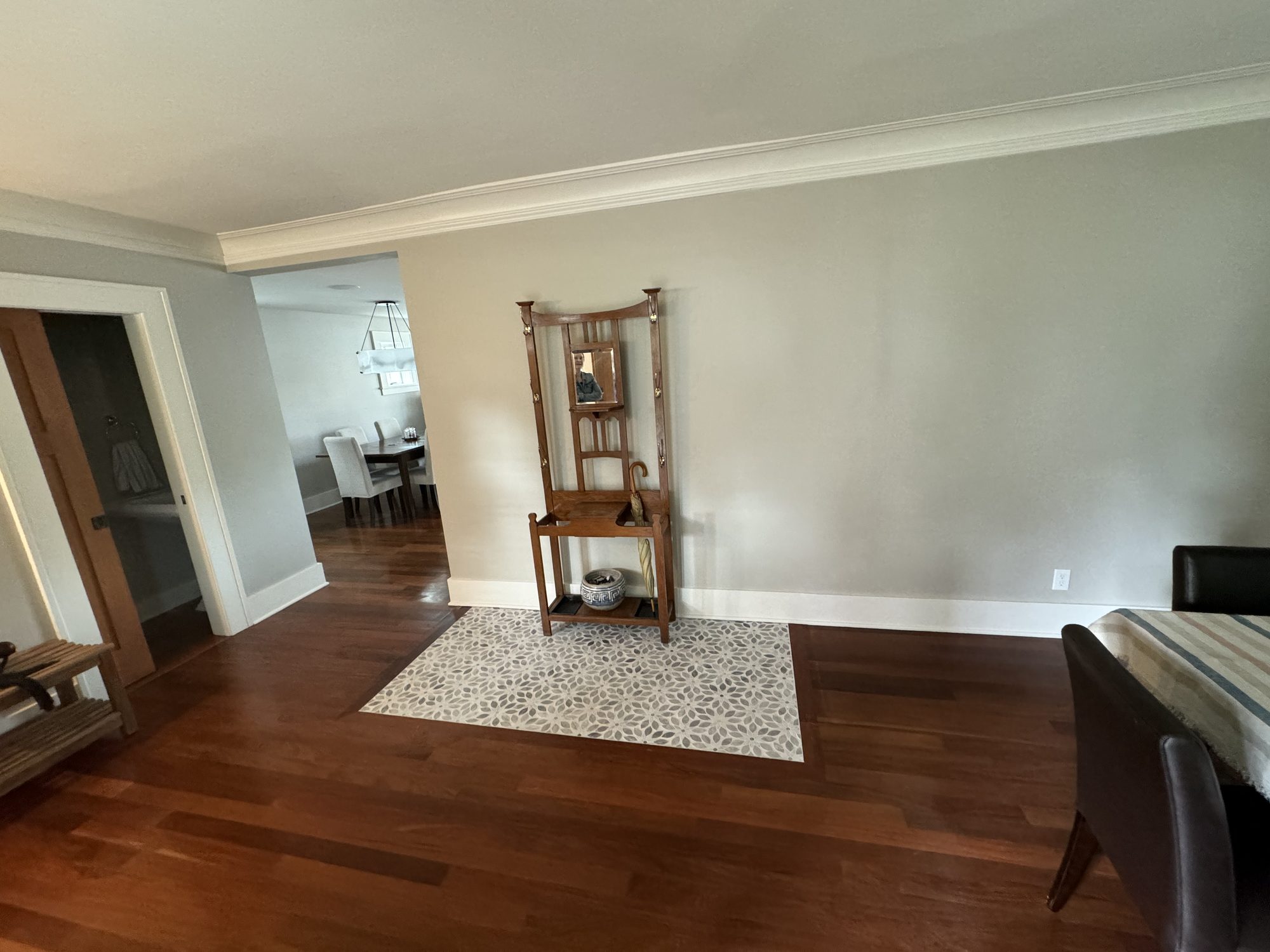 Finished living room with refinished hardwood and matched trim