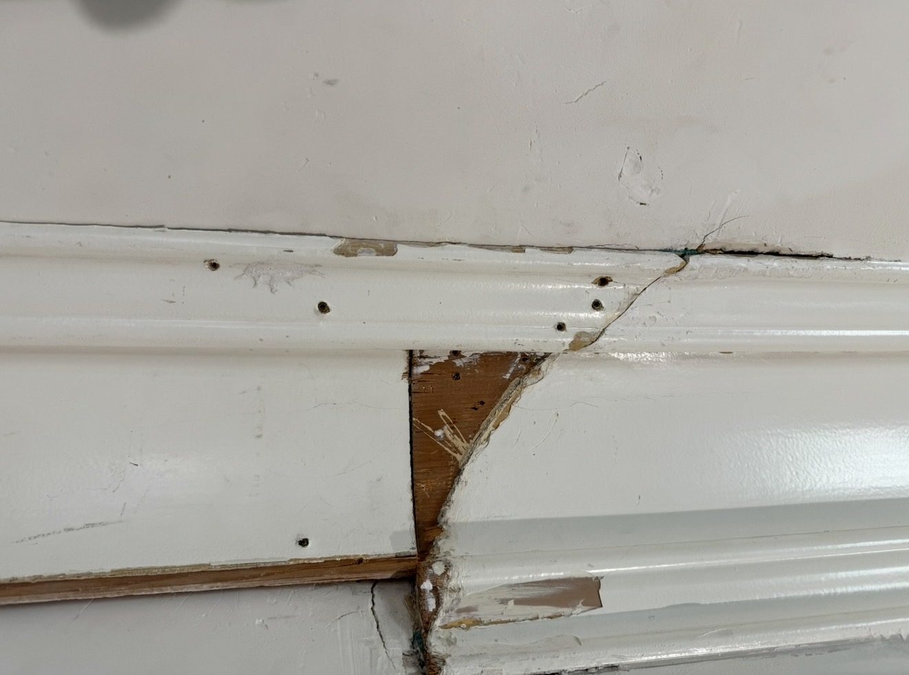 Repaired and matched crown molding in a historic home
