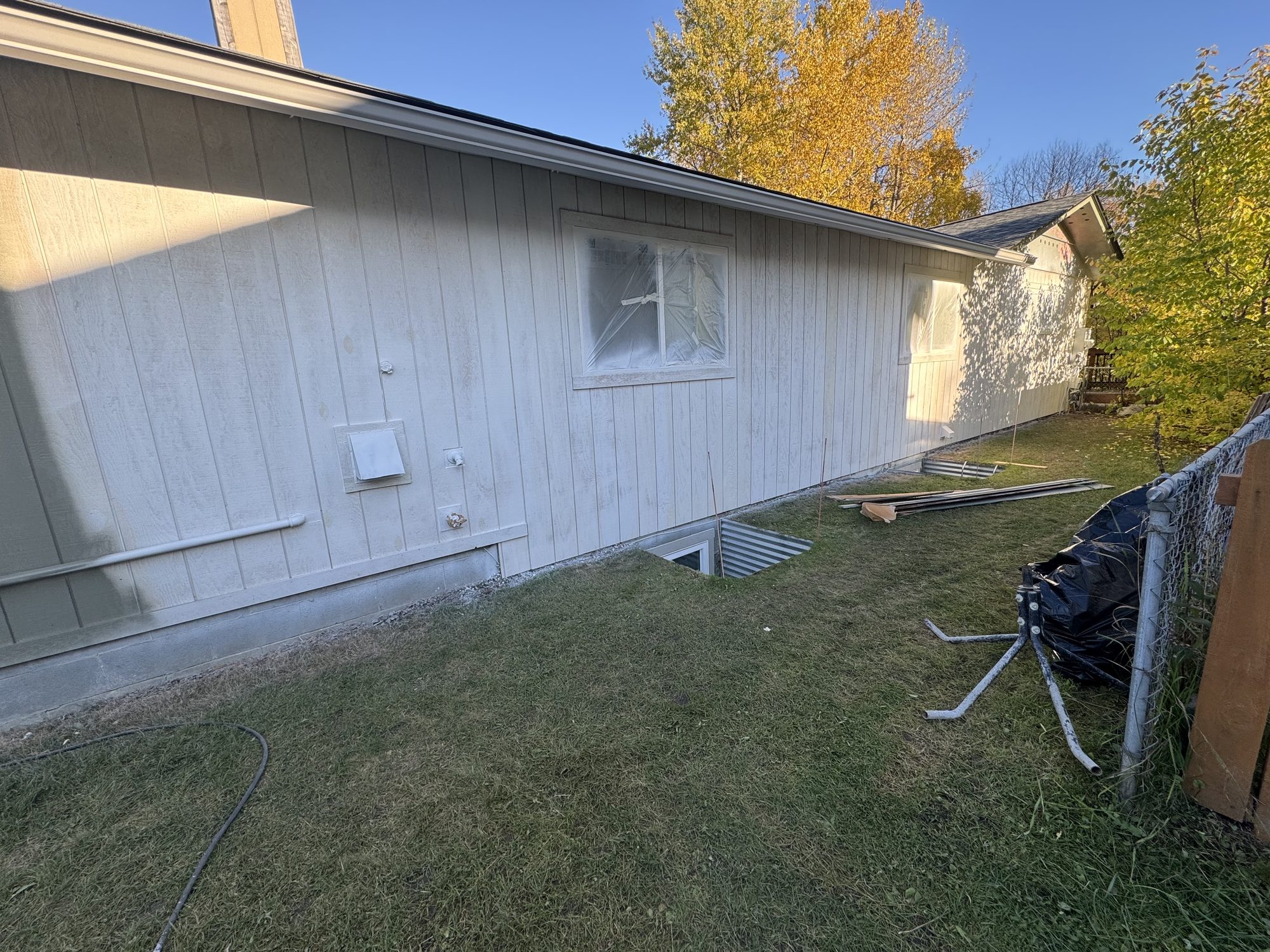 House exterior stripped back mid-siding-remodel