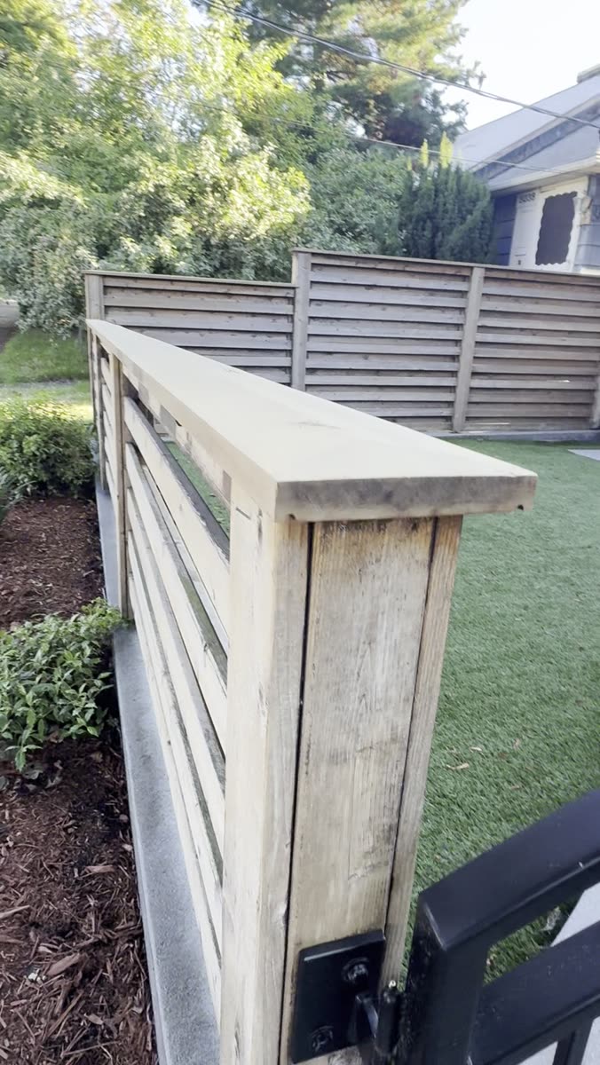 Finished corner post on a re-stained privacy fence