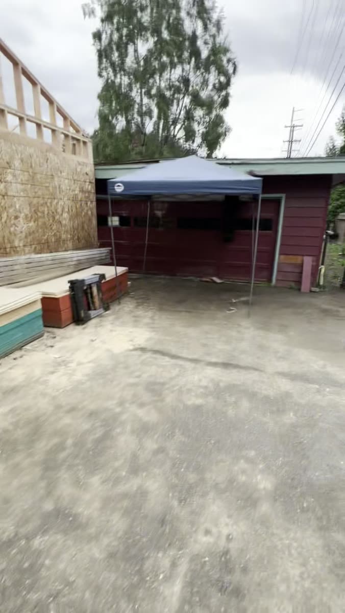 Job site around a detached garage under construction