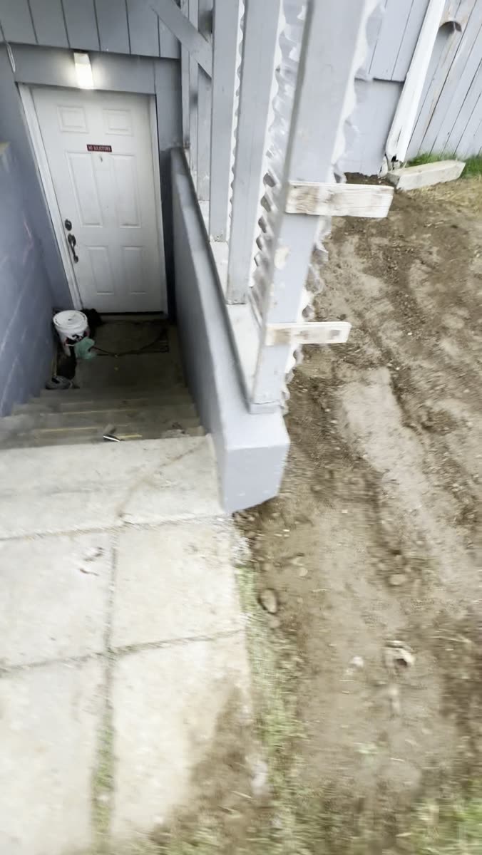 Ground regraded beside the rebuilt stairwell