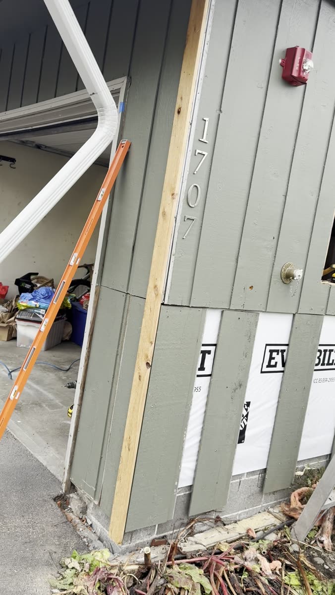 House wrapped in weather barrier during an exterior siding remodel